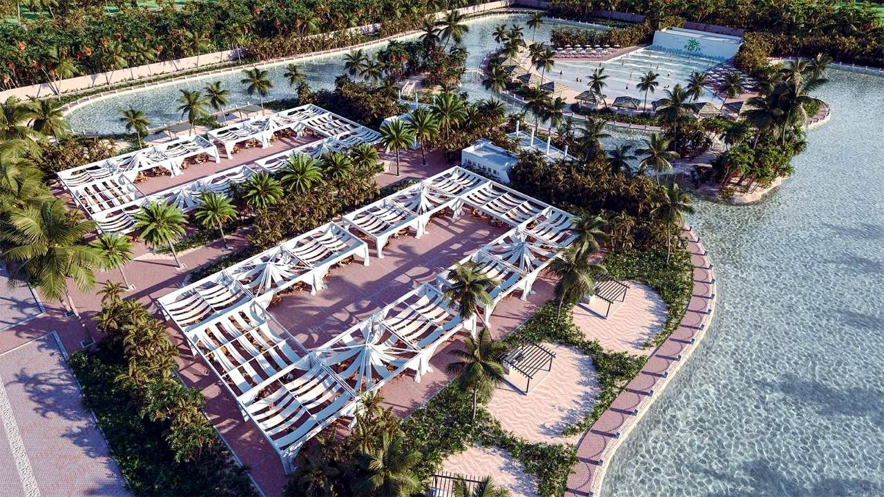 Vista aérea de un club con lago artificial en Ciudad Maderas